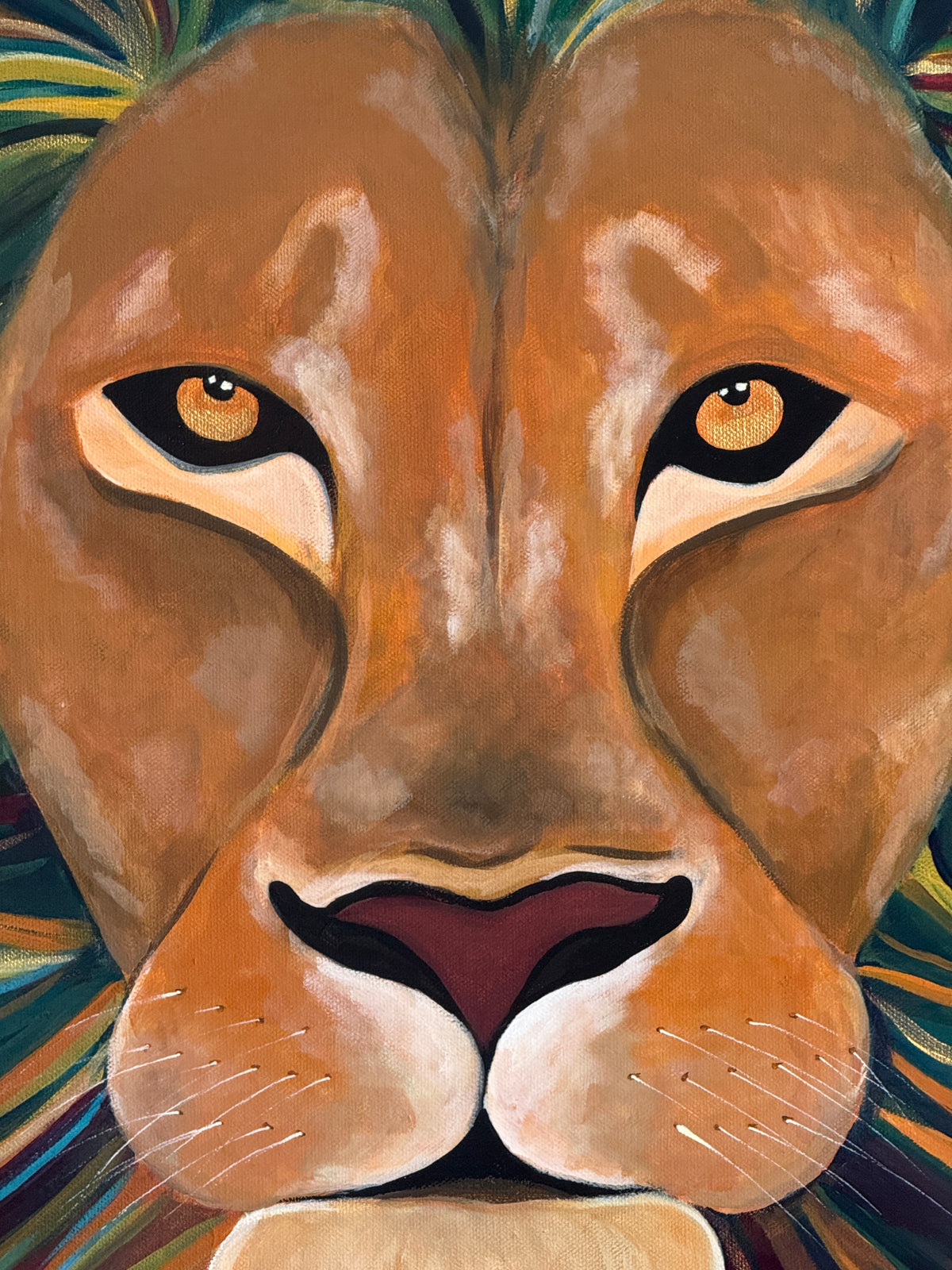 A close-up painted portrait of a lion face filling the frame, with warm tan and brown fur, cream around the muzzle, dark eyes, and multicolored striped accents in the mane and background.